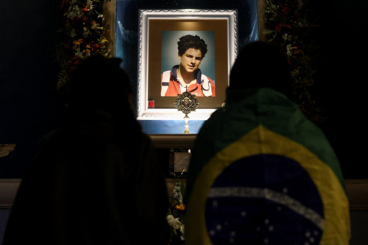 Photograph of Carlo Acutis's portrait being displayed